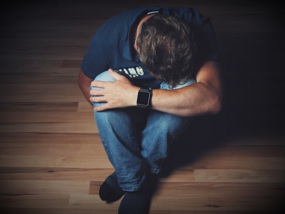 man suffering from addiction