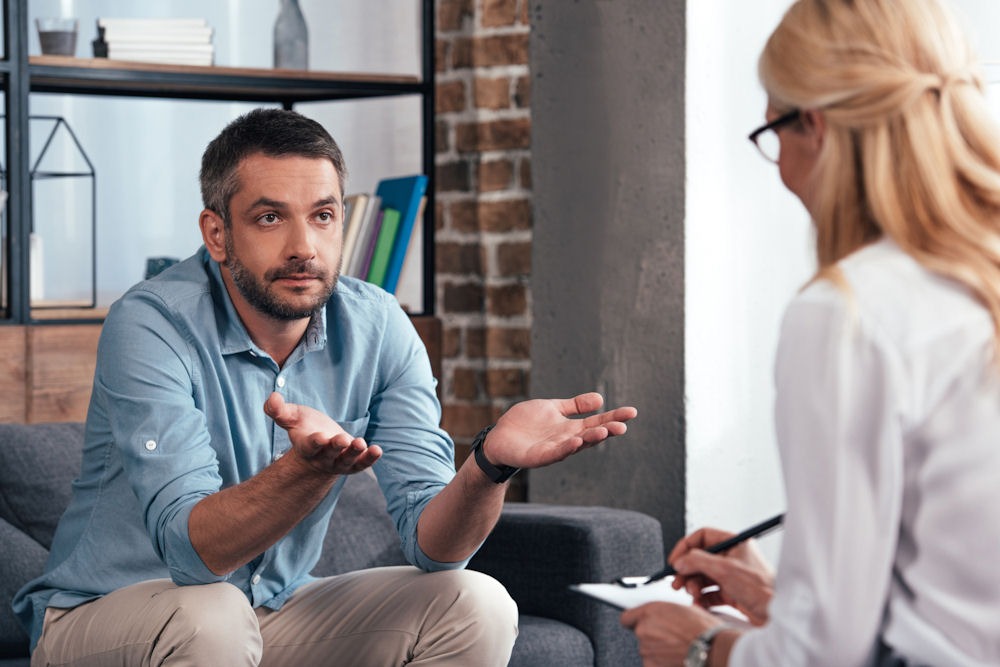 a man suffering from anxiety and addiction undergoing therapy
