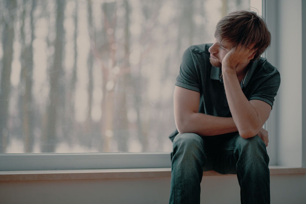 man suffering from anxiety and addiction