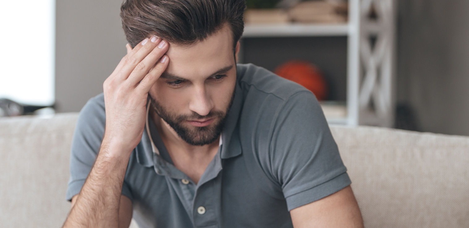 Man coping with withdrawal symptoms from codeine addiction
