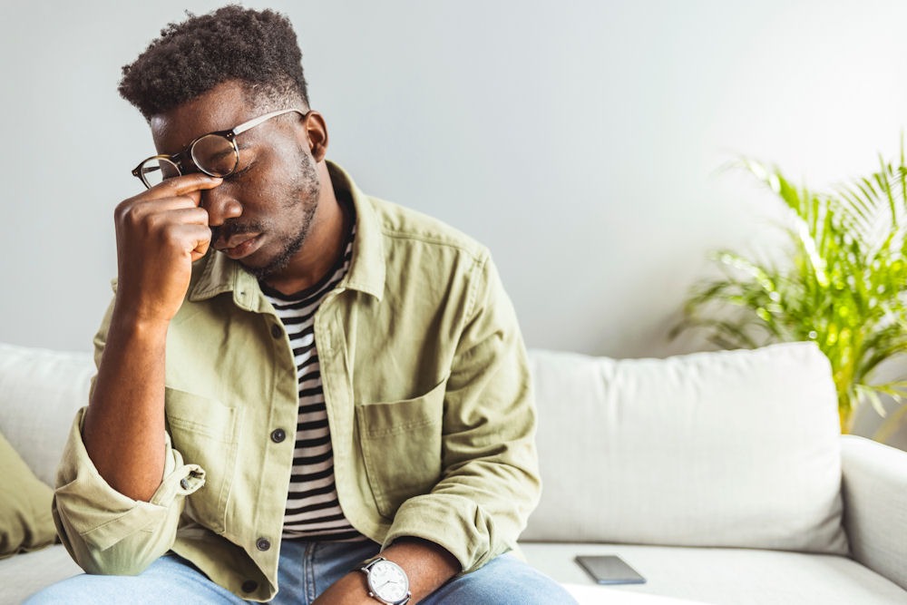 Man showing emotional distress from codeine addiction